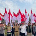 Pembagian 10 juta Bendera Merah Putih dalam rangka menyambut peringatan Kemerdekaan Republik Indonesia (Latif/Eksposisi)